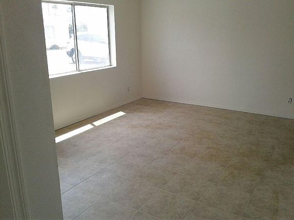 Living room features new flooring, light fixtures and fresh