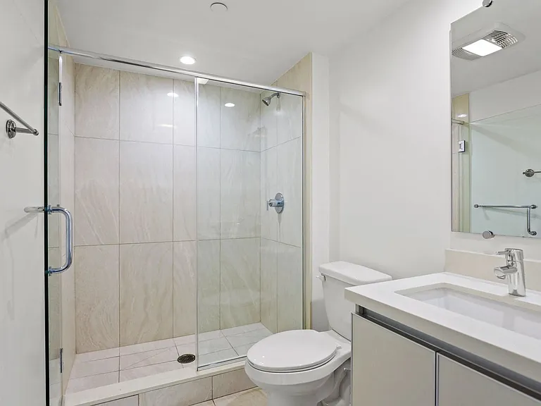 Bathroom with Walk-In Shower and Vanity Cabinet Storage