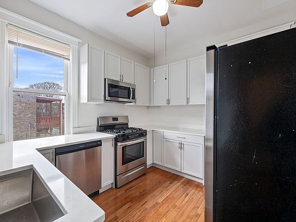 Newly renovated kitchen with ample counter space and storage.