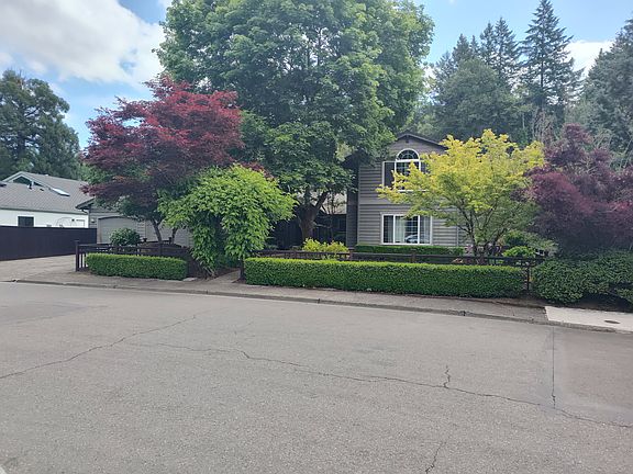 Great curb appeal with lush landscape.