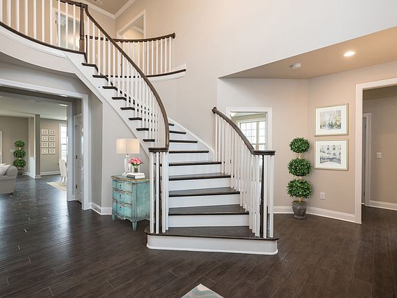 Stunning Foyer with Curved Staircase