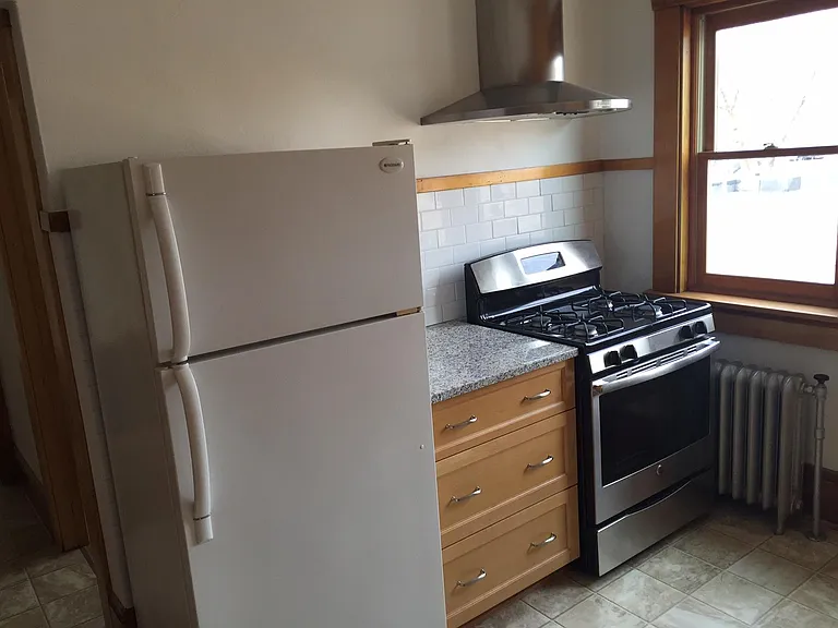 Hi-end gas stove/range perfect for those who love to cook! Stainless steel range and hood complete the look. New refrigerator.