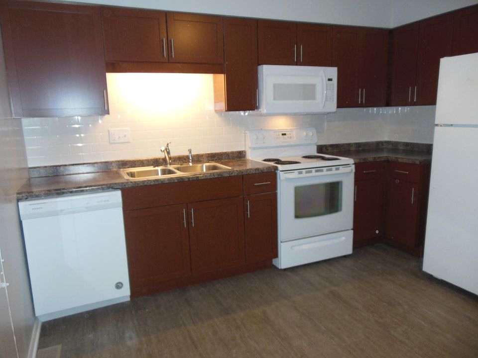 All new kitchen subway tile back splash with dish washer, garbage disposal, microwave, range and frig with ice maker and vinyl plank flooring.