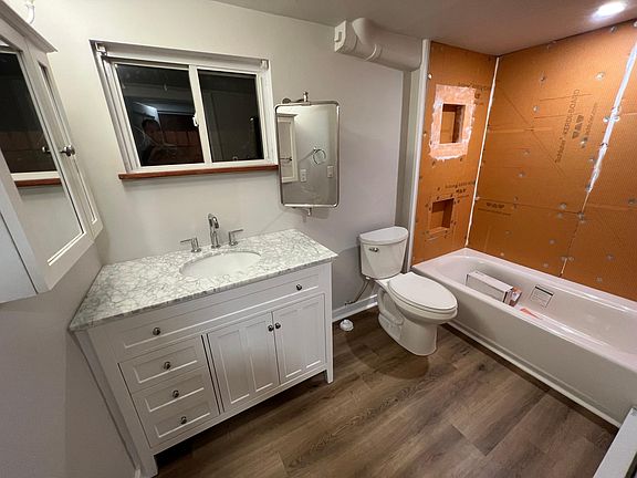 Brand new bathroom (tile in shower still being completed). Vanity with marble top