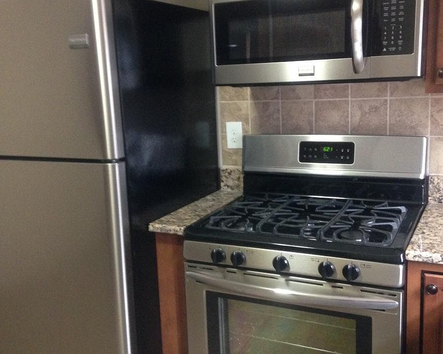 Stainless appliances with five burner gas stove