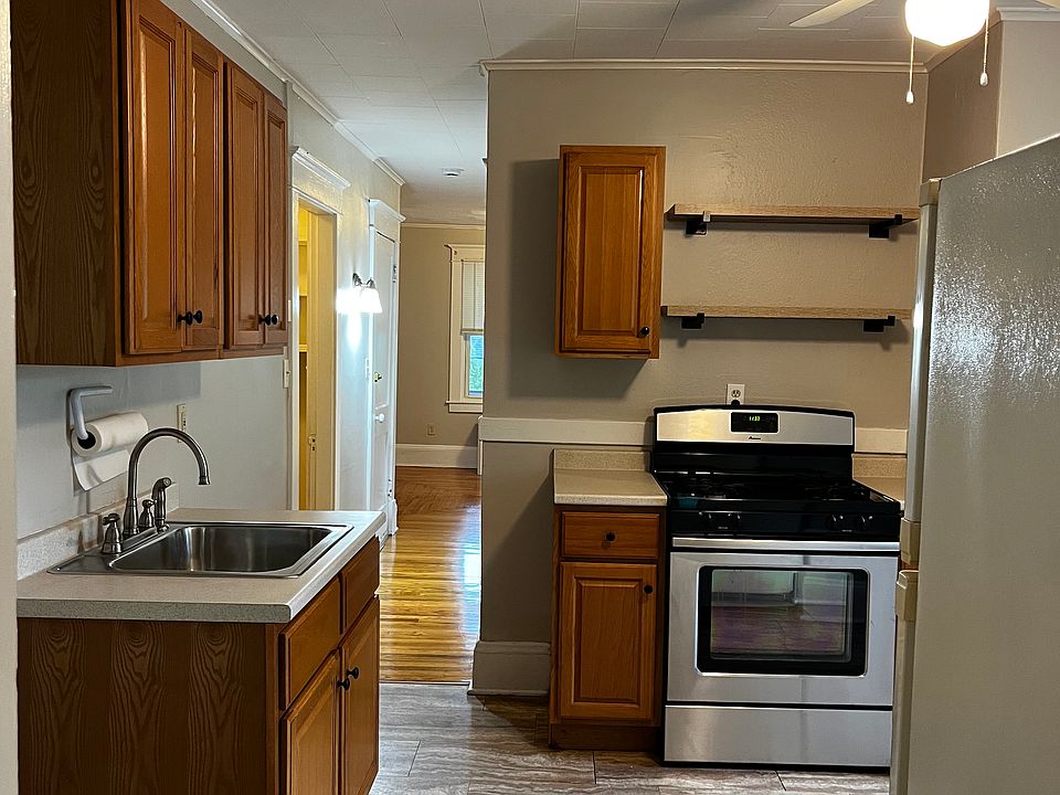 Kitchen looking down hall into livingroom. Pantry and bedroom off hallway.