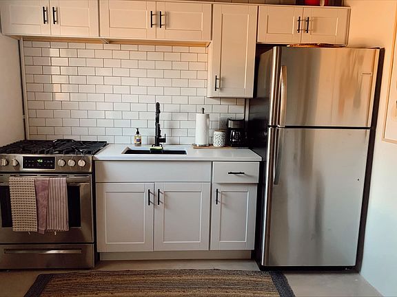 Kitchen is all new with white cabinets, quartz countertop and stainless steel appliances.