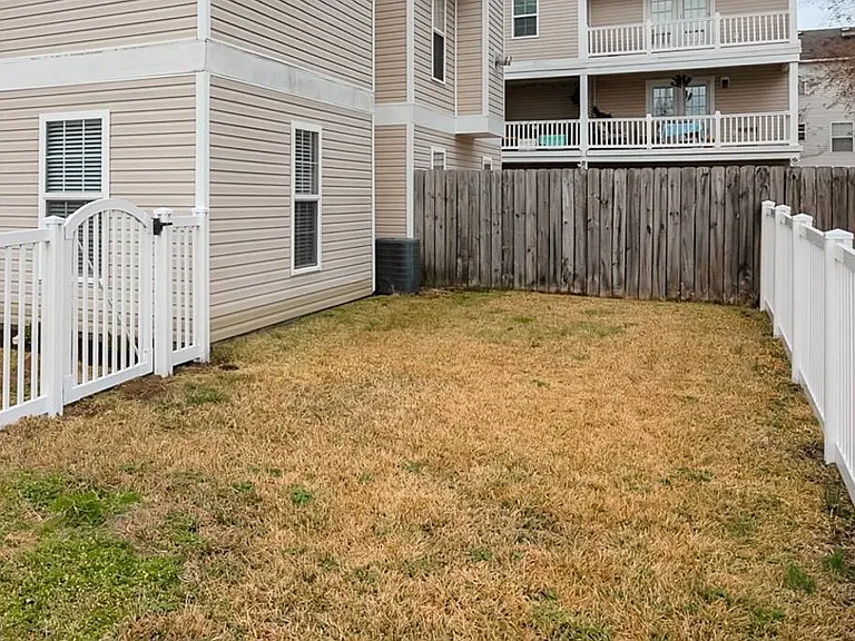 Fully fenced yard on the side of the house for your (pre approved) furry family members!