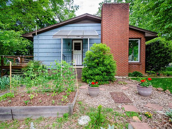 Side yard with gardens.