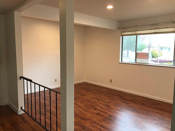 Step-down, large living room with LED dimming ceiling lights, laminated floor