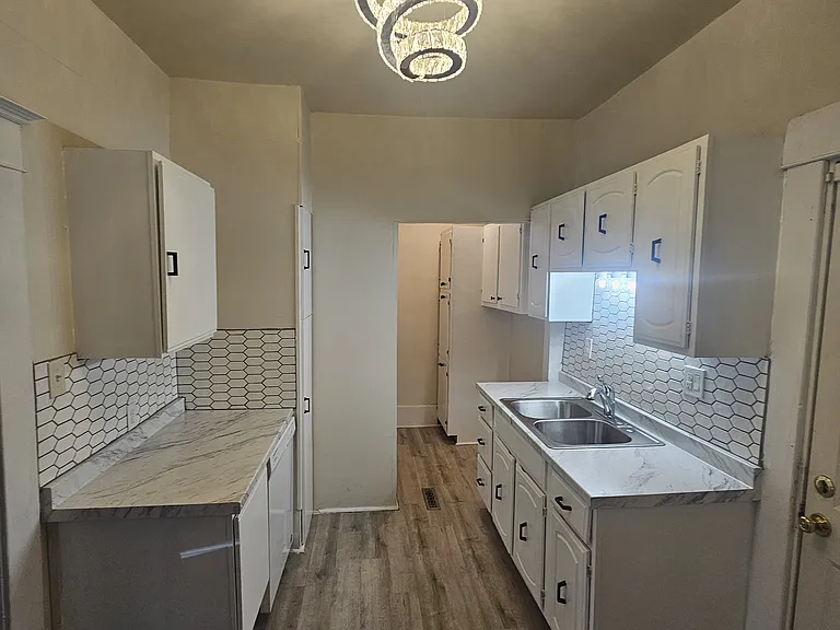 Lots of cabinet space. White cabinets.