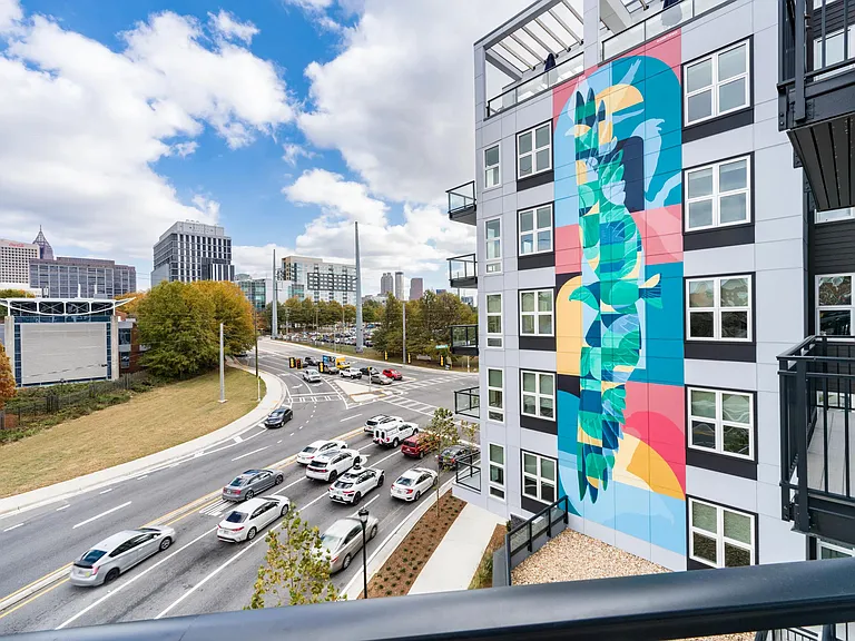 The bold exterior mural at Modera Westside Trail adds a creative presence, connecting the building's design to the surrounding Atlanta streetscape.