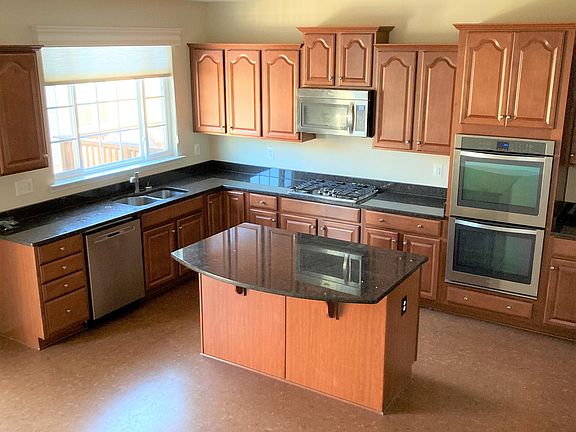 Upgraded kitchen with SS appliances and granite counter tops.