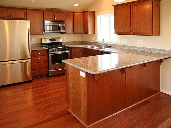 Showcase kitchen with slab granite countertops 