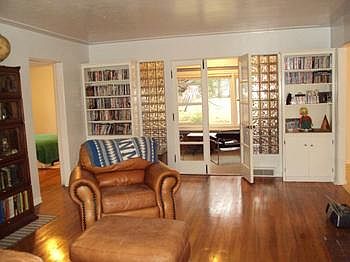 The other end of the living room has french doors to a sunroom.