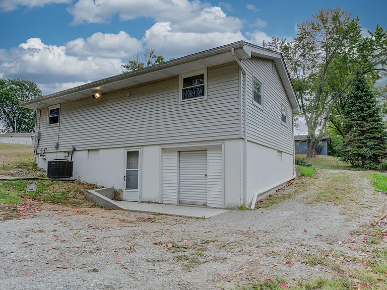 The rear of the home showing the driveway to one side.