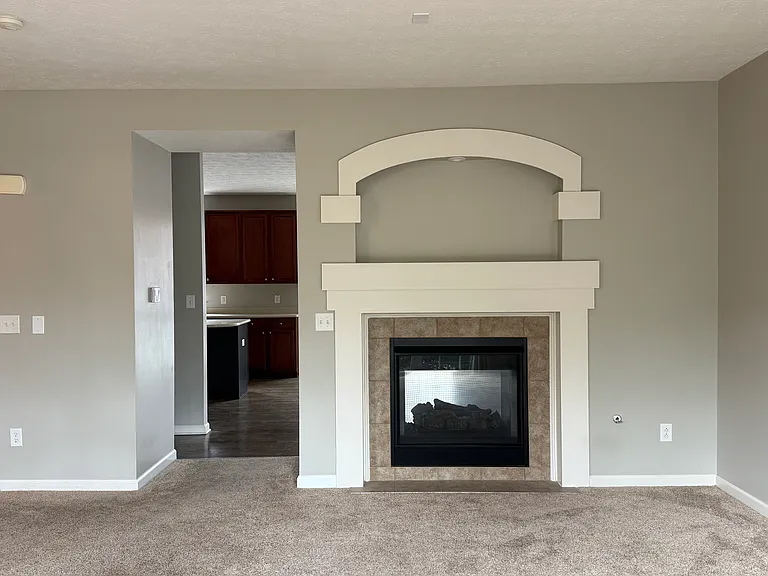 The living room has a double sided fireplace shared with the dining room.