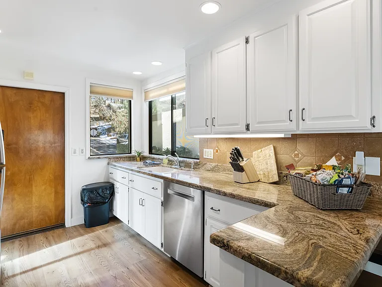 The kitchen features plenty of counter space for cooking and entertaining.