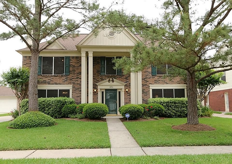 Beautiful 2 story brick home with large trees and mature landscaping has great curb appeal in the ma
