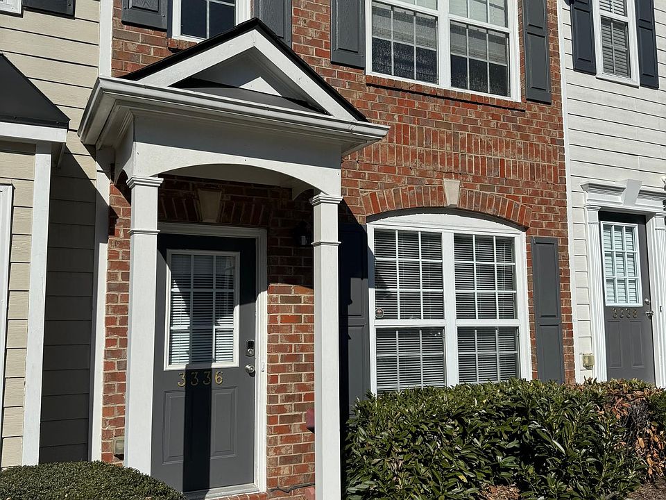 All brick townhome, trim painted 2024