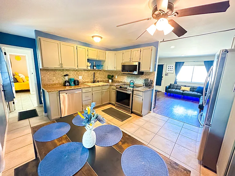 Cook Up a Storm! ____ _ Discover your inner chef in our well-stocked kitchen, featuring utensils and kitchenware. Enjoy meals with family or friends at the spacious 6-seater dining table.