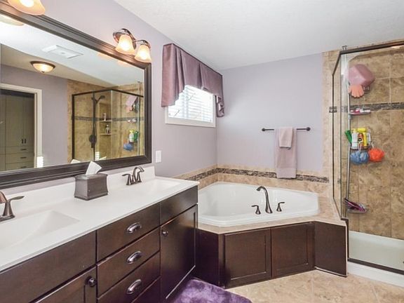THE PRIVATE AND BEAUTIFUL MASTER BATHROOM, LOTS OF ORIGINAL ADDED UPGRADES IN BUILDING PRICE, TILED FLOORS, UPGRADED CARPETING, CEILING FANS, UPGRADED LIGHTING AND MUCH, MUCH MORE!