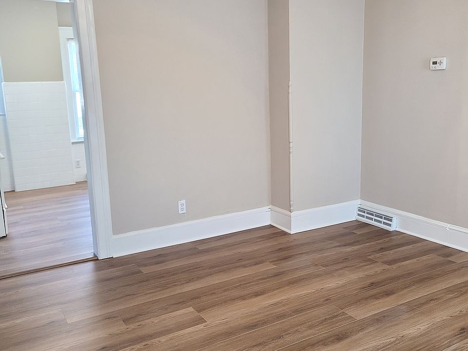 CHARMING WIDE NATURAL WOOD TRIM THROUGHOUT! LIVING ROOM TO KITCHEN!