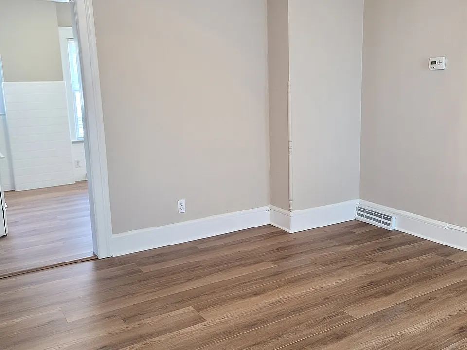 CHARMING WIDE NATURAL WOOD TRIM THROUGHOUT! LIVING ROOM TO KITCHEN!