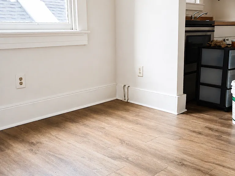 Small living room leading to kitchen