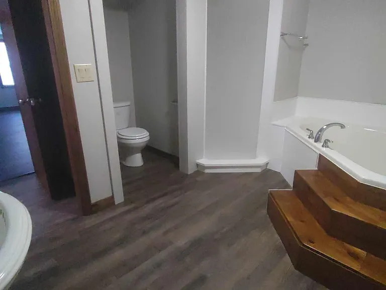 Separate shower stall and toilet stall