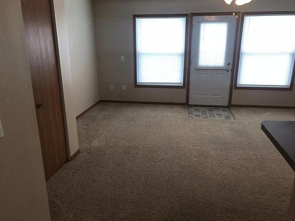 Exterior door to patio and large back yard.