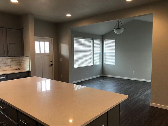 Tucked in dining area next to kitchen.