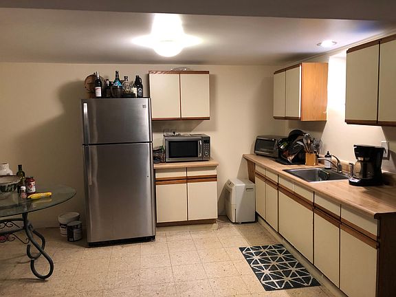 Kitchen area with good lighting and plenty of counter space.