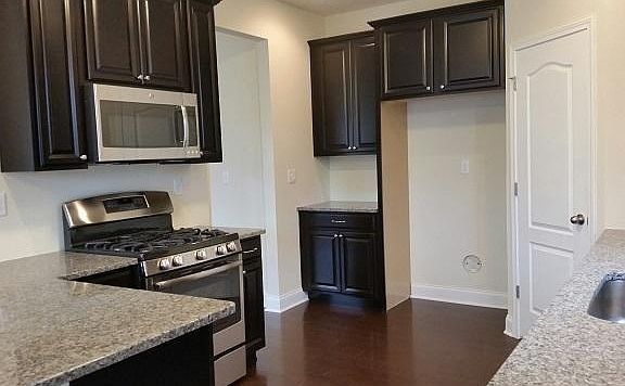 Maple Espresso Cabinets with New Caledonia Granite