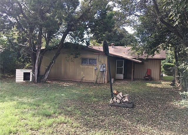 Back yard has plenty of shade from trees. Come make it yours TODAY!