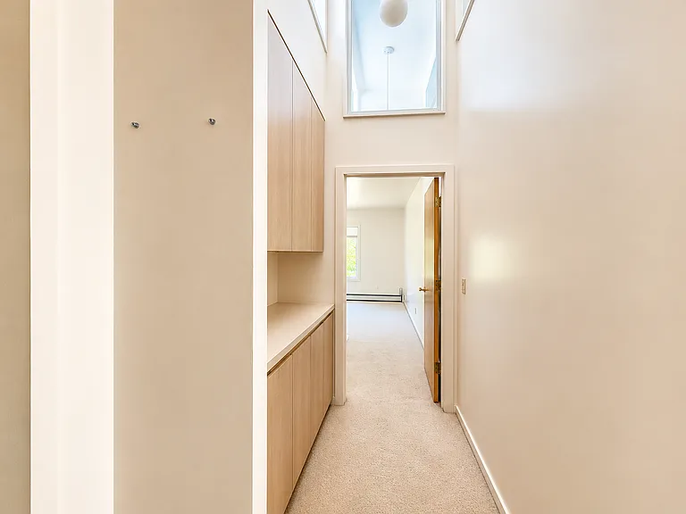 This is the view from the hall through the storage area and into the bedroom.