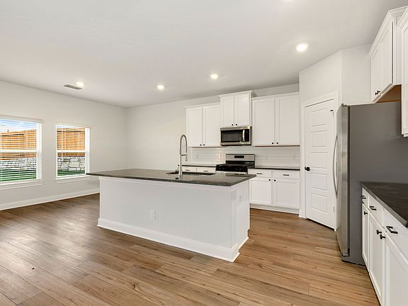 Upgraded kitchen with an oversized island and sprawling countertops.