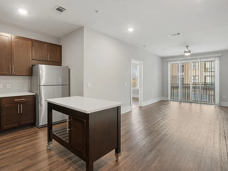 Overhead lighting in kitchen, dining and living areas.