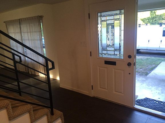 entry with all new tile floors downstairs