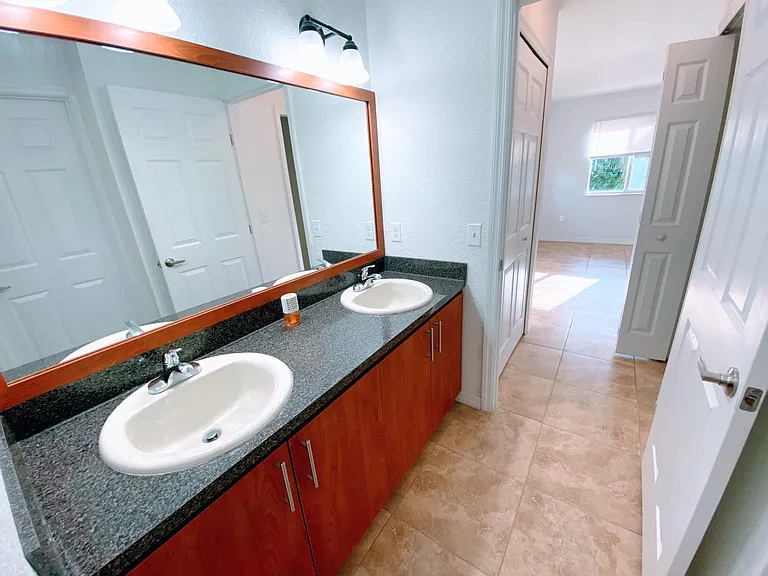 Double sink area separate from rest of bahtroom