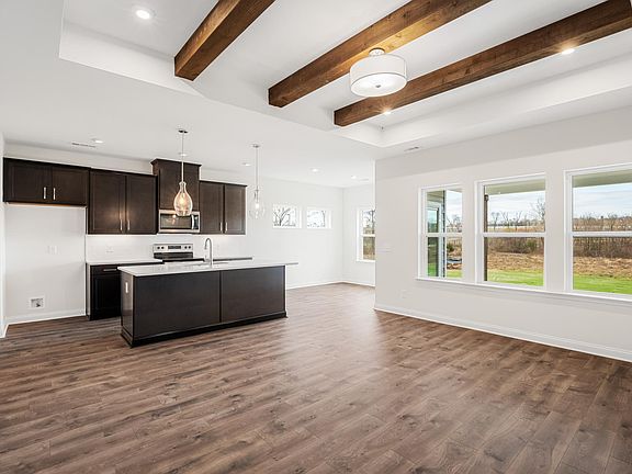 kitchen island with family room in the distance