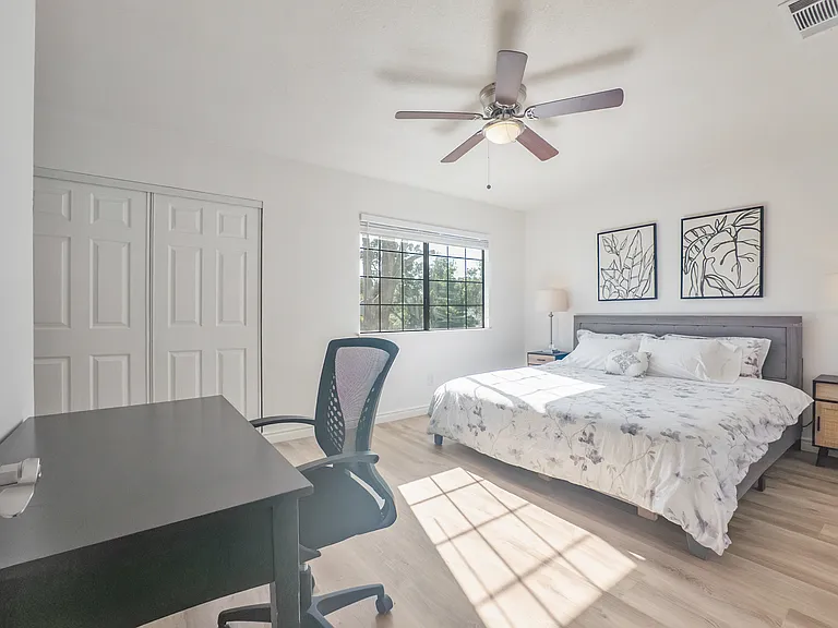 Bedroom # 1 with a king bed, work station, smart TV, and en suite full bathroom