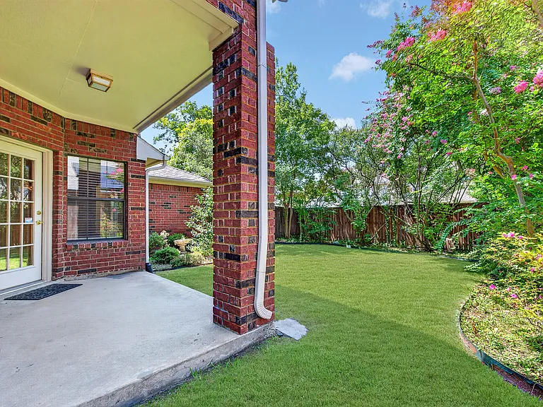 Covered Patio, landscaped backyard