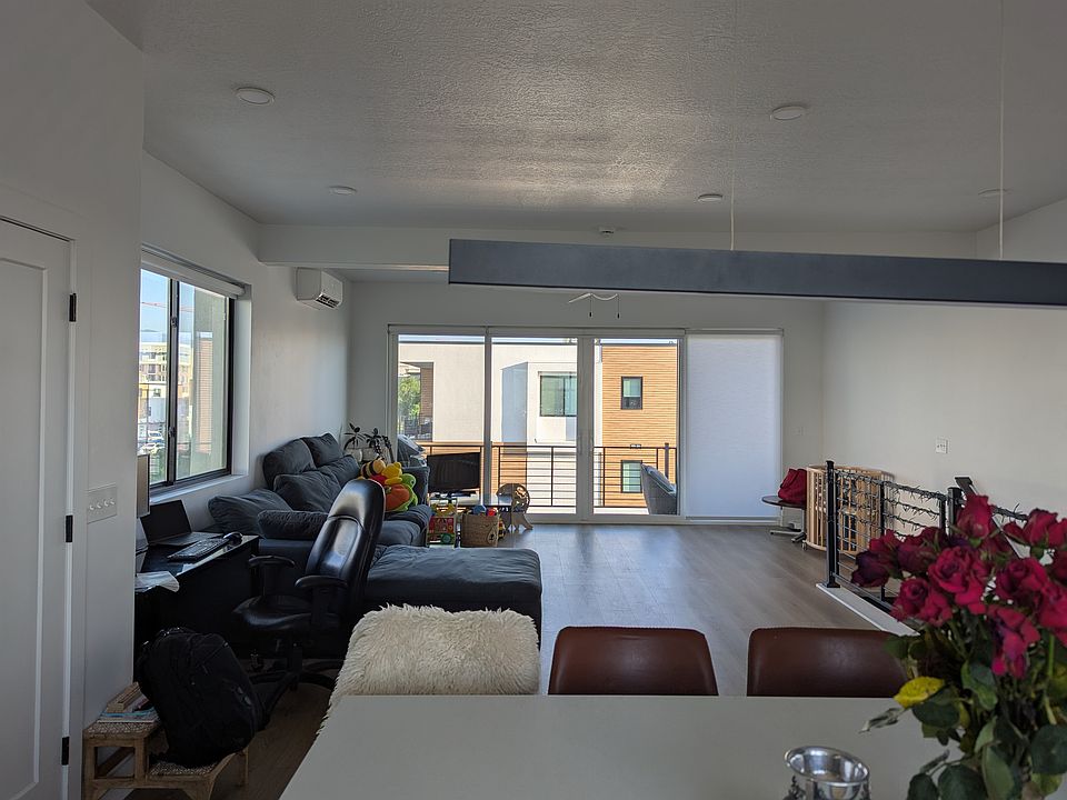 Living room featuring wood floors and plenty of natural light