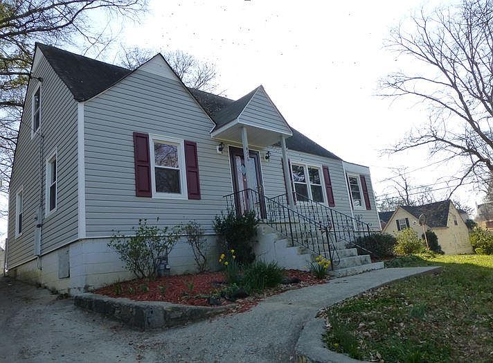 House on corner property up on a hill