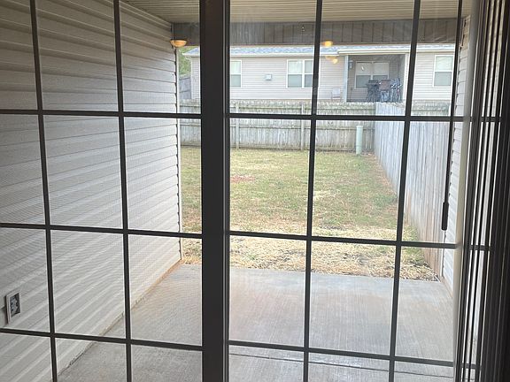 Back porch and fenced in back yard.