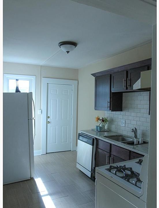 Kitchen with door that opens to the backyard