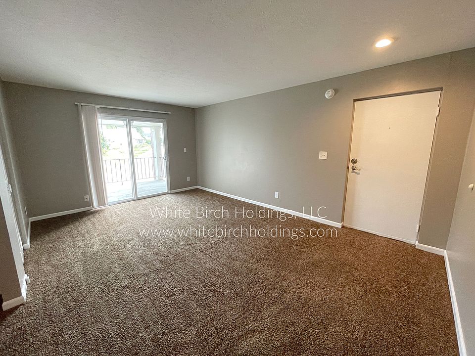 Living Room with Sliding Glass Door to Patio