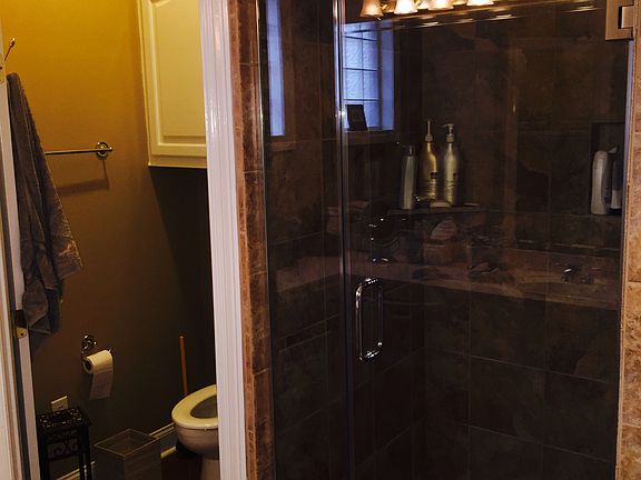 Large Master Bathroom with Ceramic Tile Countertops