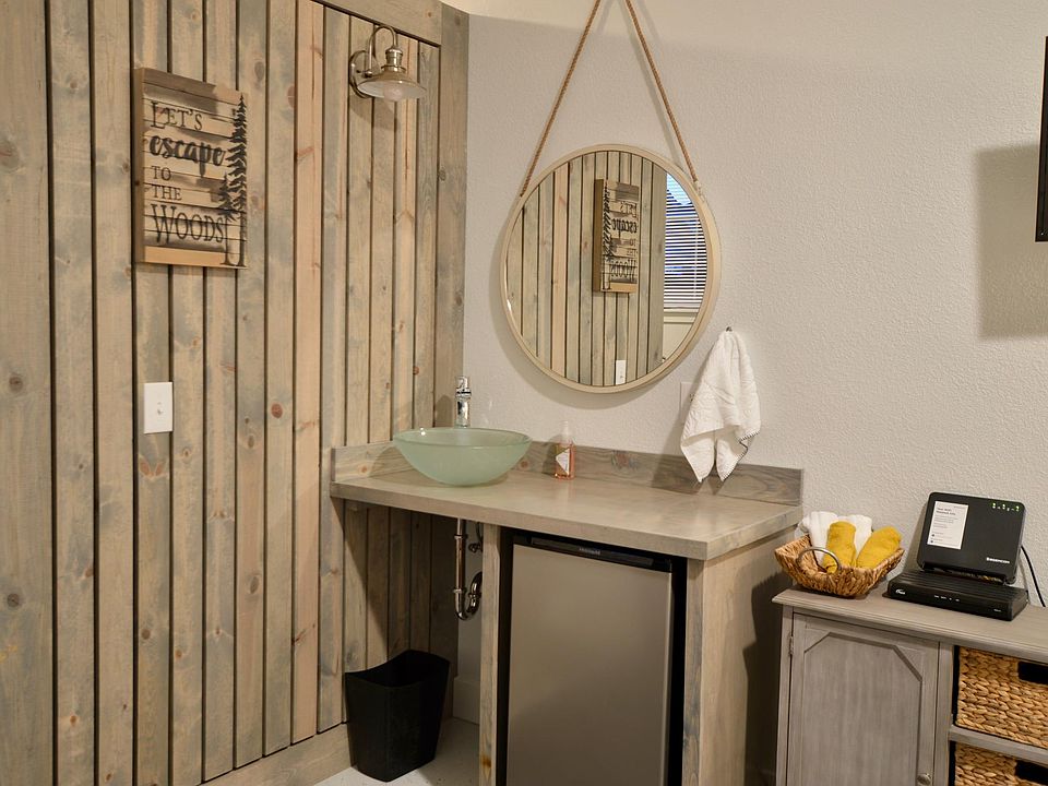 First floor Vessel sink vanity and mini refrigerator
